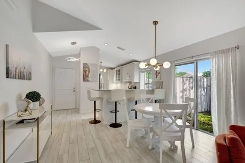 a view of dining room and hall with wooden floor