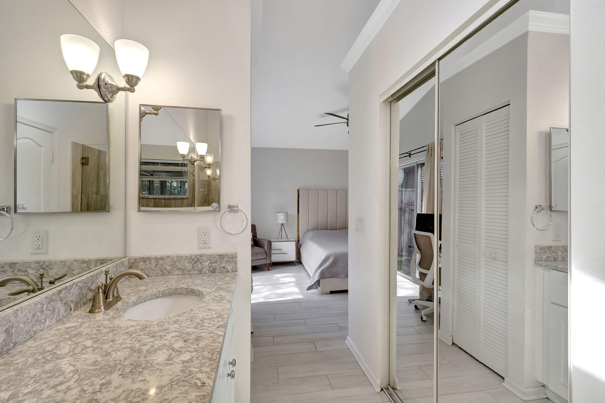 15 Admirals Court Palm Beach Gardens, FL 33418 - Photo 19 of 29 a bathroom with a granite countertop sink mirror and cabinets