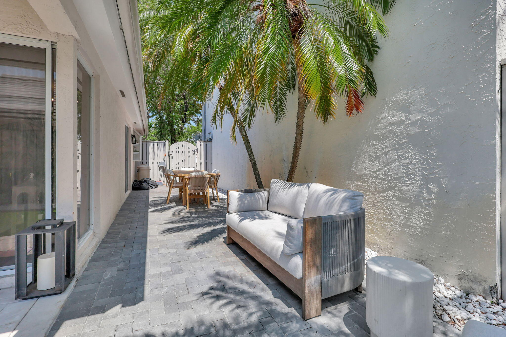 15 Admirals Court Palm Beach Gardens, FL 33418 - Photo 22 of 29 a view of a patio with couches and a potted plant