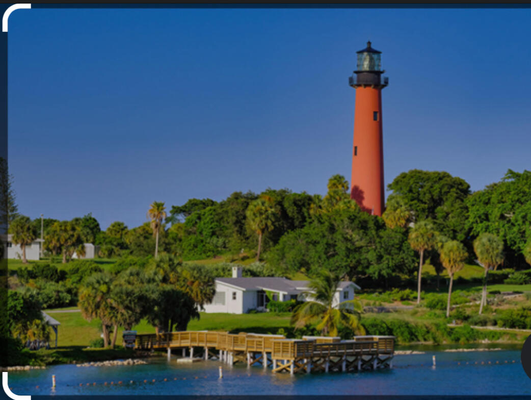 15 Admirals Court Palm Beach Gardens, FL 33418 - Photo 28 of 29 a front view of a building with garden