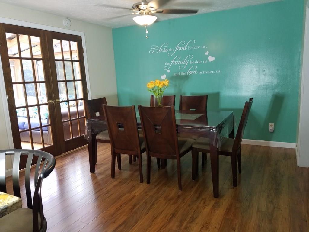 5 Jolicoeur Road Spencer, MA 01562 - Photo 12 of 33 a view of a dining room with furniture window and wooden floor