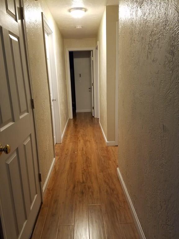 5 Jolicoeur Road Spencer, MA 01562 - Photo 20 of 33 a view of a hallway with wooden floor