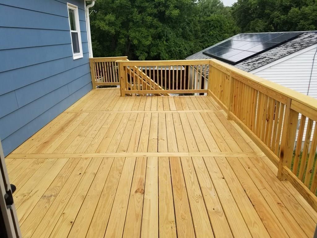 5 Jolicoeur Road Spencer, MA 01562 - Photo 8 of 33 a view of deck with wooden floor and fence