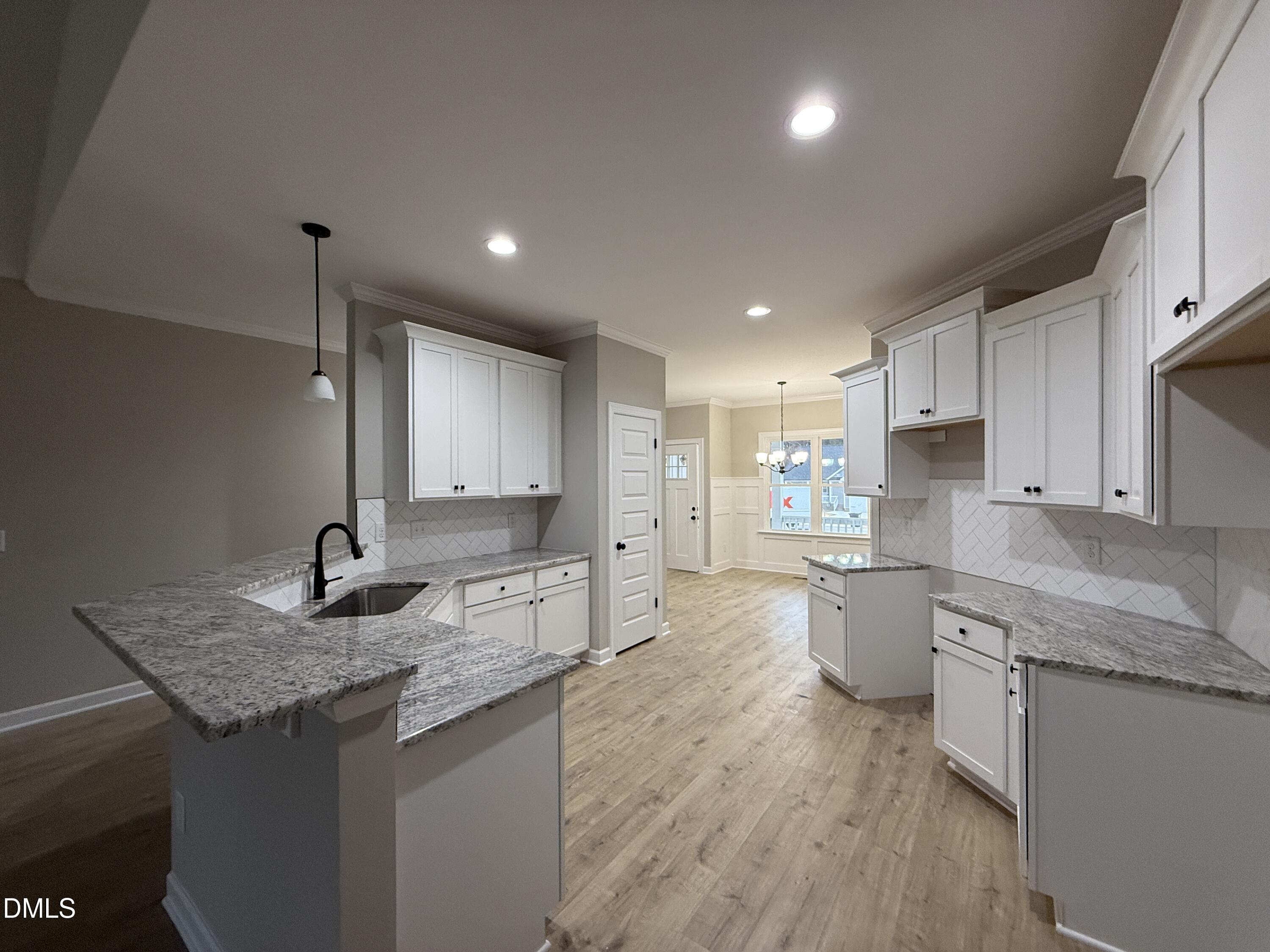 181 Royal Avenue Selma, NC 27576 - Photo 4 of 10 a kitchen with sink stove and cabinets
