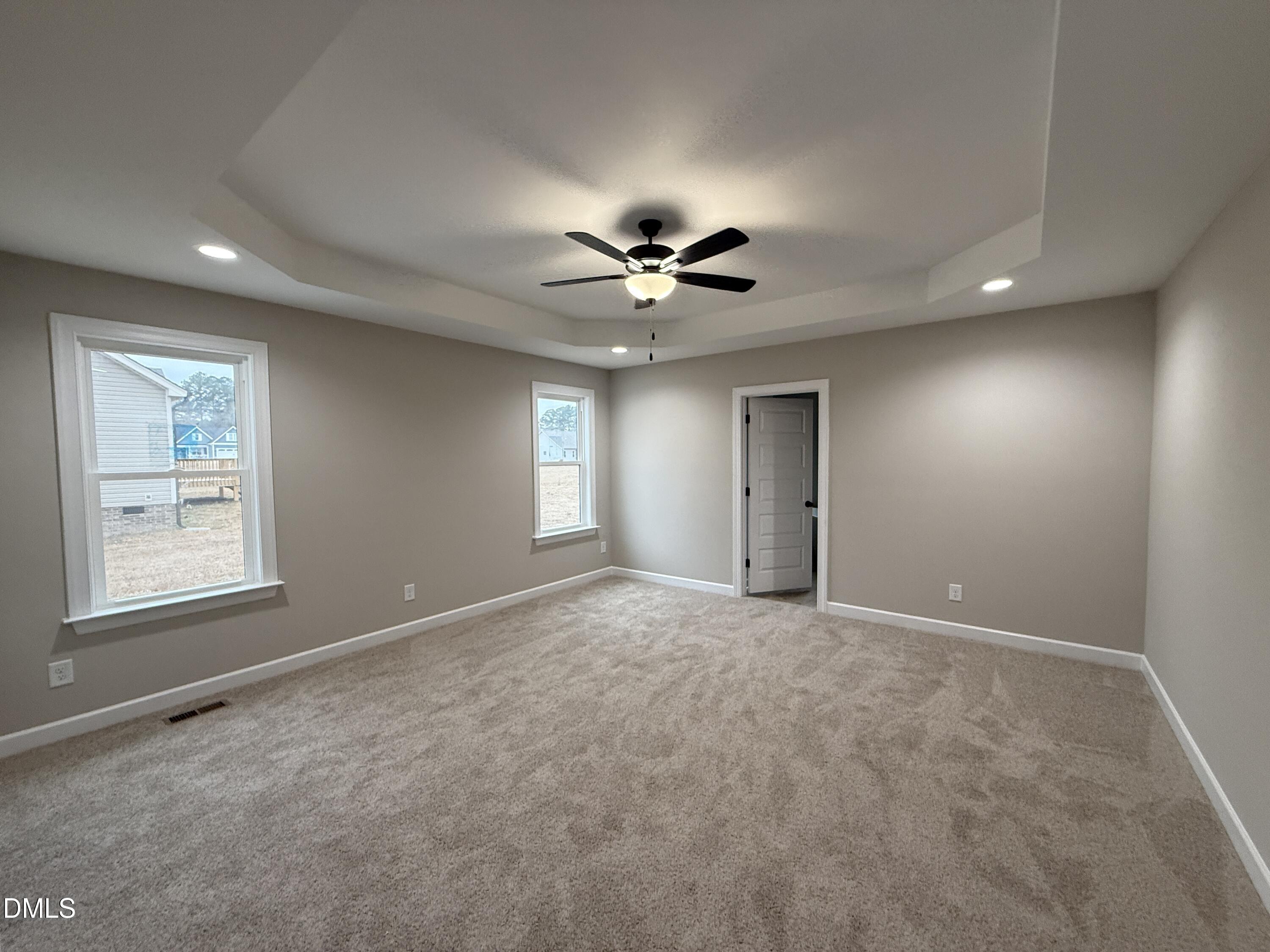 181 Royal Avenue Selma, NC 27576 - Photo 6 of 10 a view of a livingroom with a ceiling fan and window
