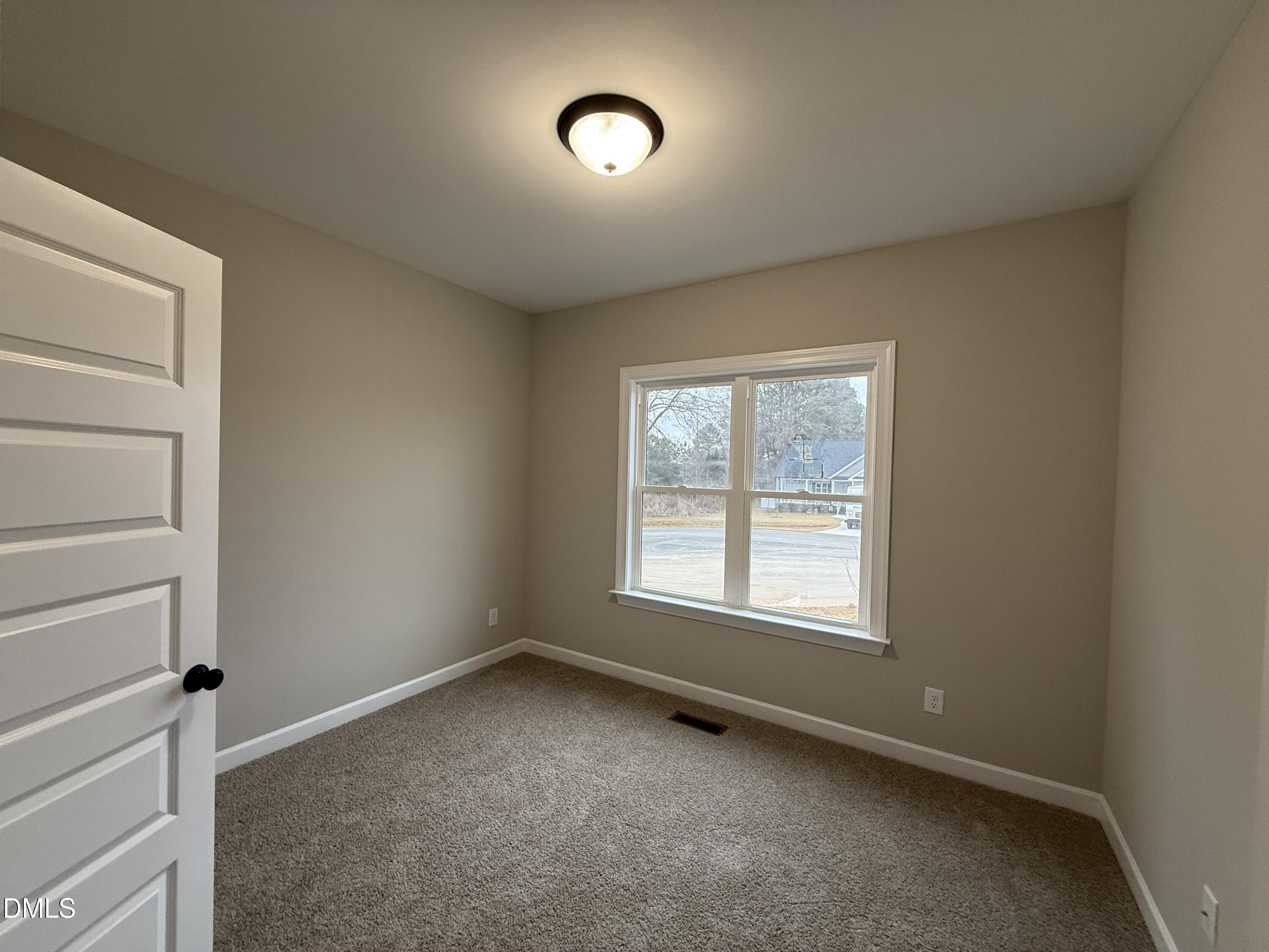 181 Royal Avenue Selma, NC 27576 - Photo 10 of 10 a view of an empty room with a window