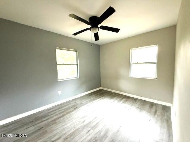 1664 Randall Road Macon, GA 31206 - Photo 8 of 9 a view of empty room with wooden floor and fan
