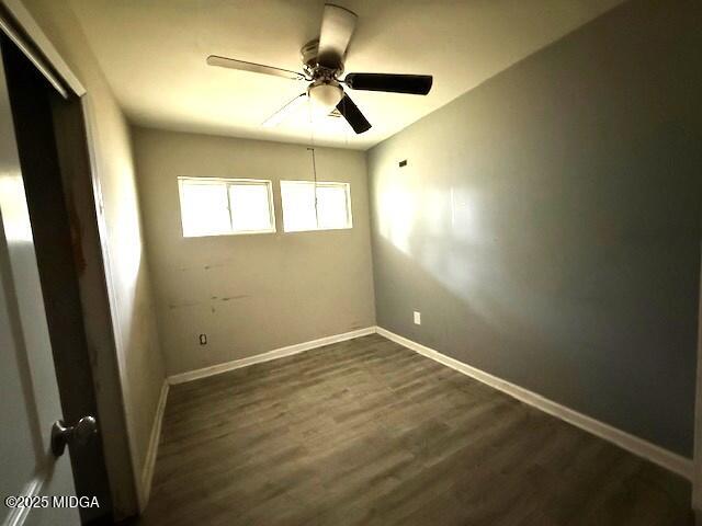 1664 Randall Road Macon, GA 31206 - Photo 9 of 9 an empty room with windows and fan