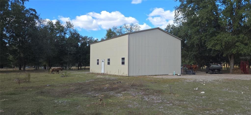 0 Jacobs Way Brooksville, FL 34601 - Photo 9 of 23 a backyard of a house with table and chairs