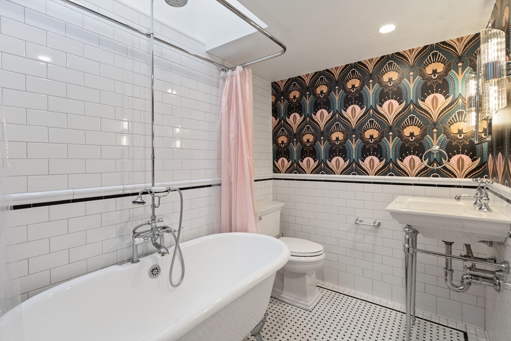 220 South Main Street Sherborn, MA 01770 - Photo 18 of 40 a bathroom with a sink a toilet and shower