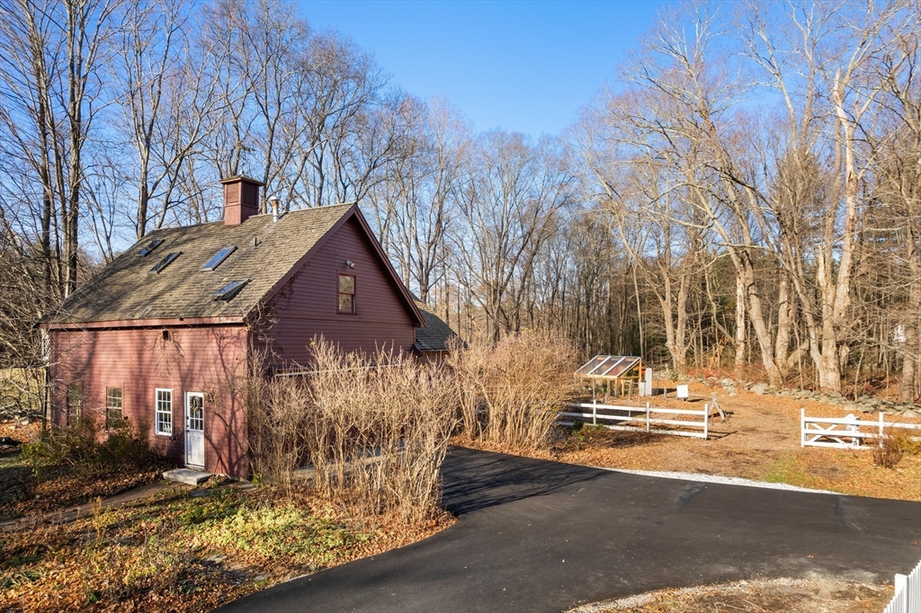 220 South Main Street Sherborn, MA 01770 - Photo 2 of 40 a view of a house with a yard covered in snow
