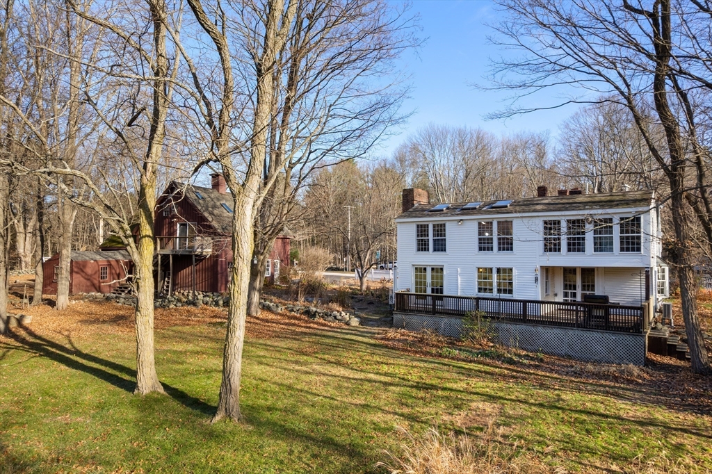 220 South Main Street Sherborn, MA 01770 - Photo 3 of 40 a view of a house with a yard covered in snow