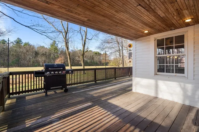 a view of a balcony with wooden floor