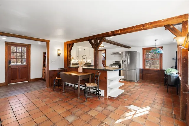 a view of a livingroom with furniture and a window