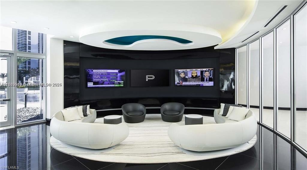 851 Northeast 1st Avenue, Unit 3303 Miami, FL 33132 - Photo 12 of 46 a living room with furniture a rug and a floor to ceiling window