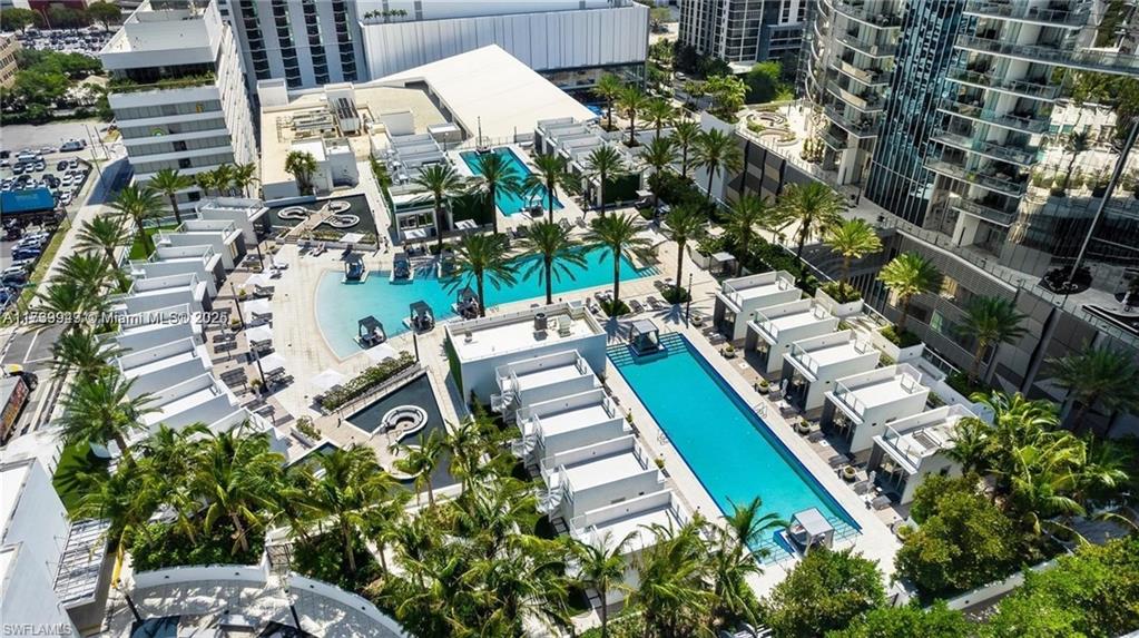 851 Northeast 1st Avenue, Unit 3303 Miami, FL 33132 - Photo 2 of 46 an aerial view of a house with a garden and trees