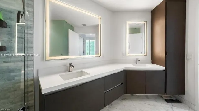 a bathroom with a sink and a mirror