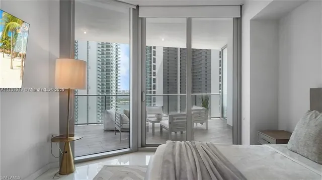 a bedroom with a bed and a mirror