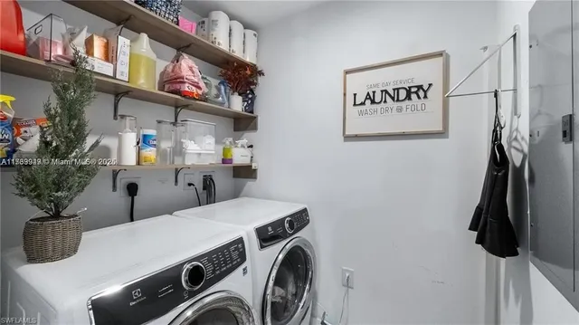 a utility room with dryer washer and shoe rack