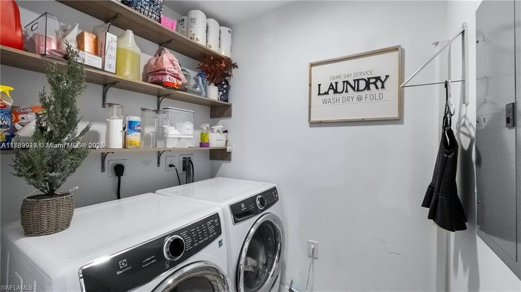 851 Northeast 1st Avenue, Unit 3303 Miami, FL 33132 - Photo 34 of 46 a utility room with dryer washer and shoe rack