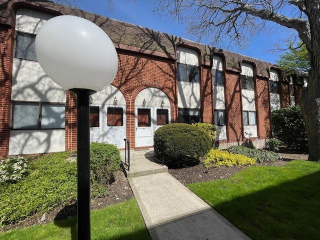 755 Chestnut Street Cedarhurst, NY 11516 - Photo 1 of 1 a front view of a house with garden