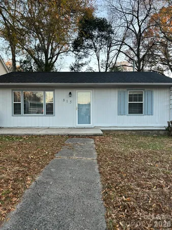 a house with trees in the background