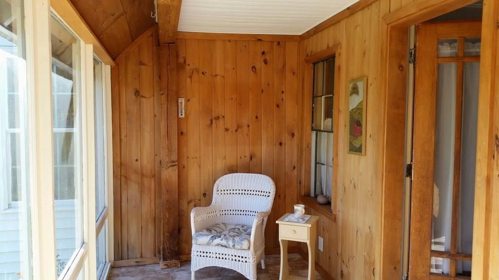 561 Fairbanks Road Farmington, ME 04938 - Photo 14 of 22 The sun-filled glass-enclosed porch...