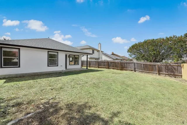 a house view with a garden space