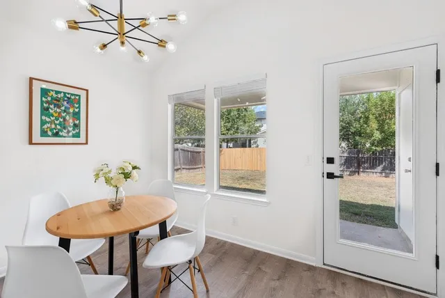 a view of a dining room with furniture window and outside view