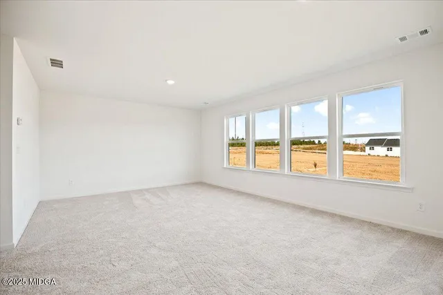 an empty room with windows