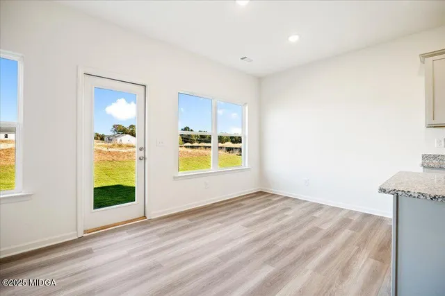 a view of an empty room and window