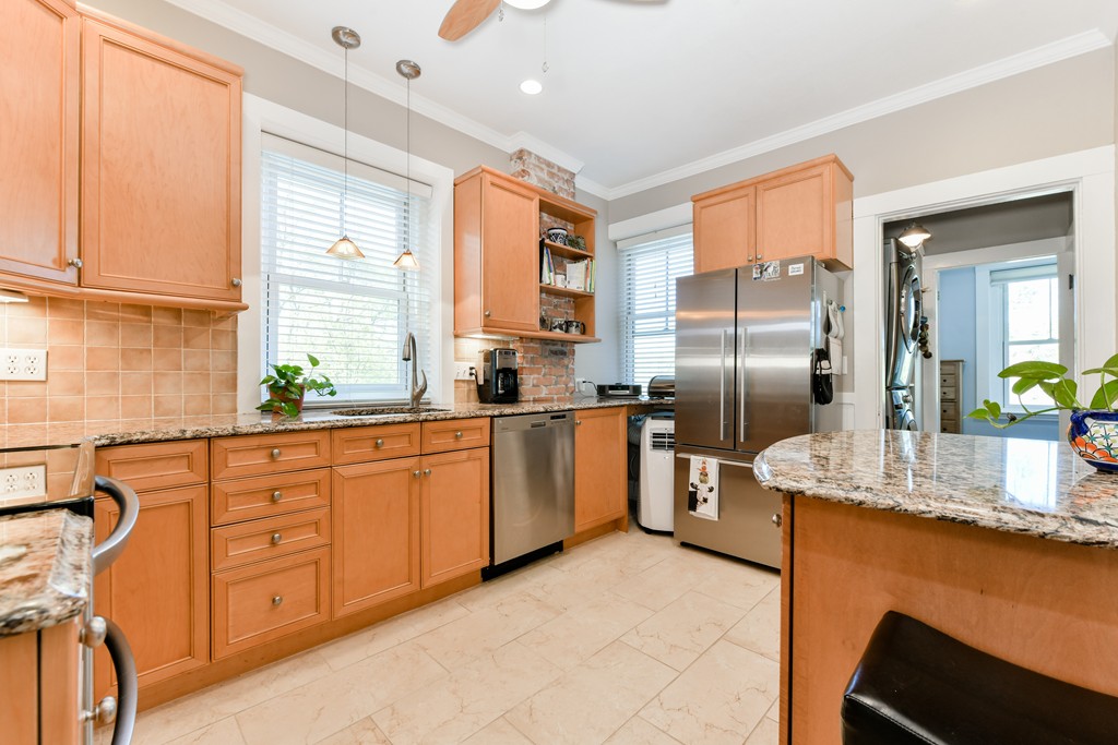 149 Winthrop Road, Unit 3 Brookline, MA 02445 - Photo 14 of 18 a kitchen with stainless steel appliances granite countertop a refrigerator and a sink