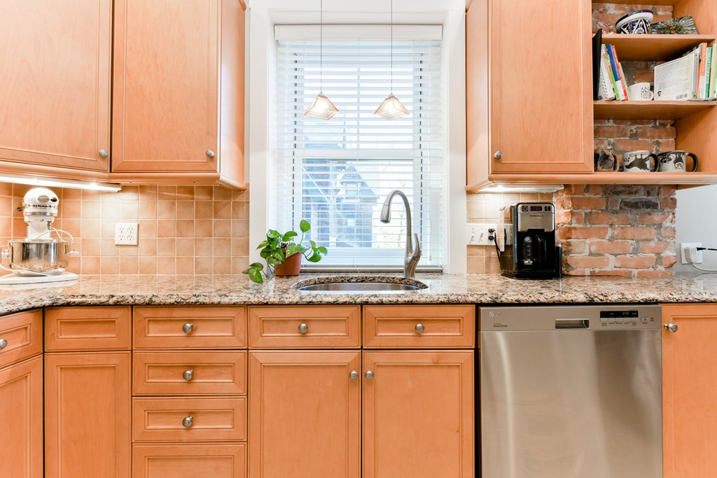 149 Winthrop Road, Unit 3 Brookline, MA 02445 - Photo 15 of 18 a kitchen with granite countertop white cabinets and sink