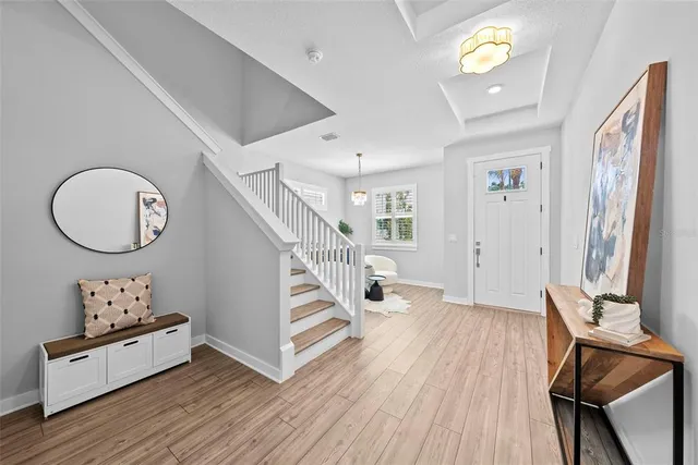 a view of a livingroom with wooden floor and chair