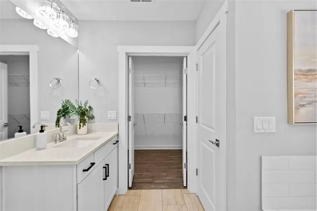 a view of hallway with wooden floor