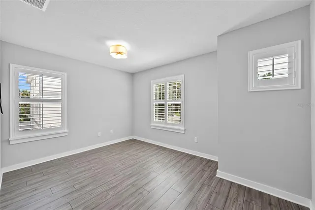 a bathroom with a shower sink and mirror