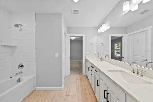 a view of an empty room with closet and a chandelier fan