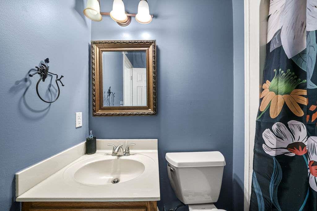7 College View Drive Southwest Rome, GA 30161 - Photo 27 of 49 a bathroom with a toilet sink and mirror