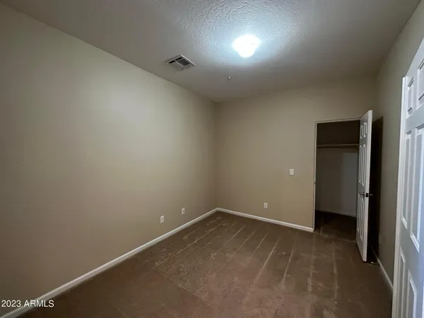 wooden floor and cabinet in an empty room