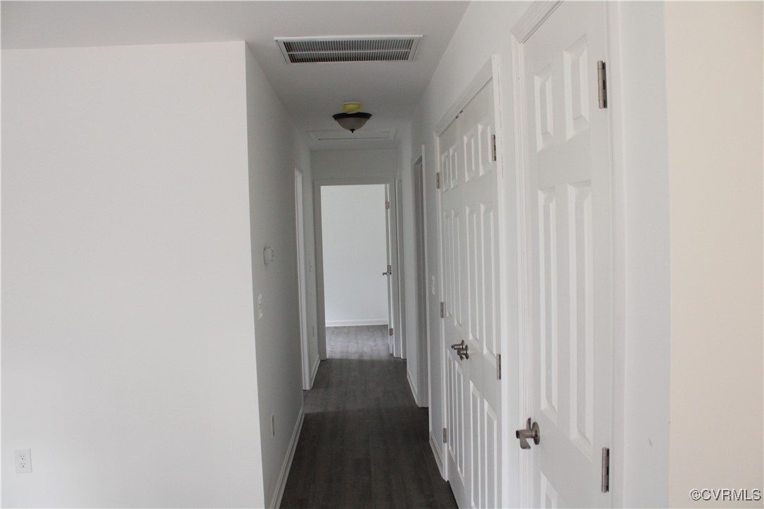10120 Alpine Road Providence Forge, VA 23140 - Photo 5 of 15 Corridor with dark wood-type flooring