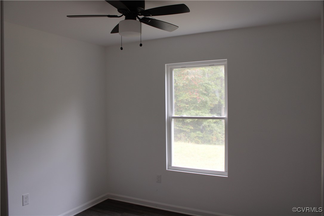 10120 Alpine Road Providence Forge, VA 23140 - Photo 7 of 15 Unfurnished room featuring ceiling fan and dark ha