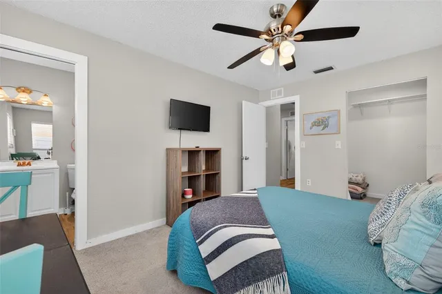 a bathroom with a sink mirror vanity and toilet