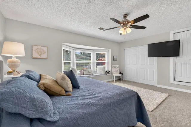 a bathroom with a granite countertop sink and a bathtub