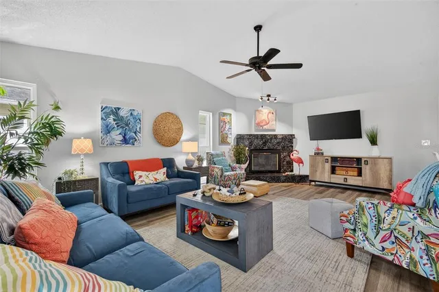 a living room with furniture and a flat screen tv