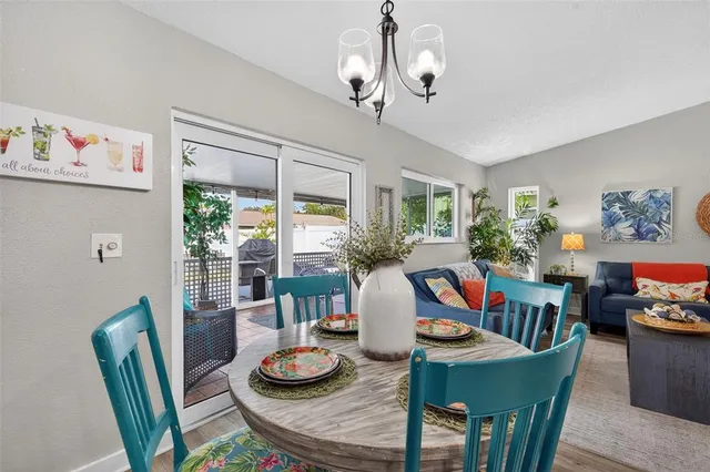a kitchen with granite countertop a refrigerator stove microwave and sink