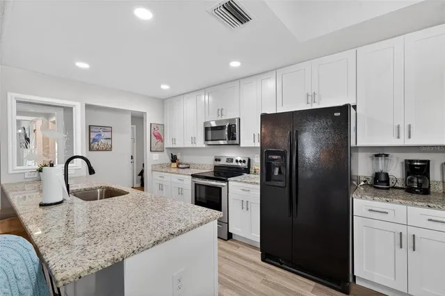 a large kitchen with lot of counter space