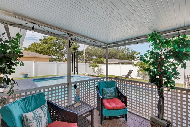 a outdoor dining space with furniture and wooden floor