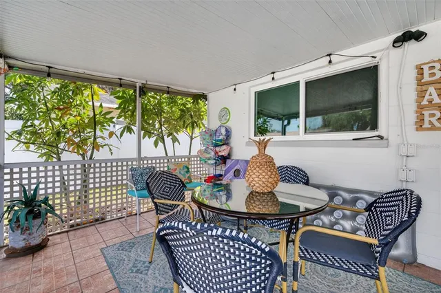 a outdoor dining space with furniture and garden view