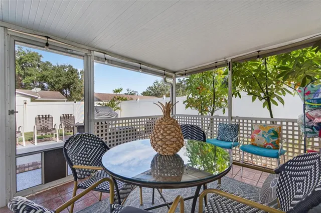 a outdoor living space with furniture and a flat screen tv