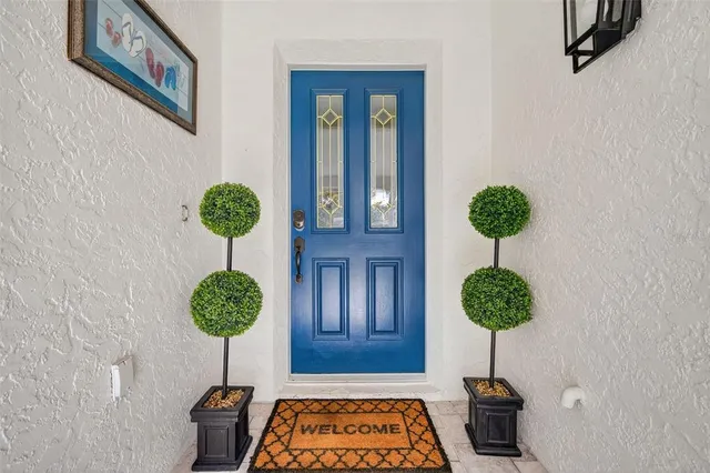 a balcony with furniture and a potted plant